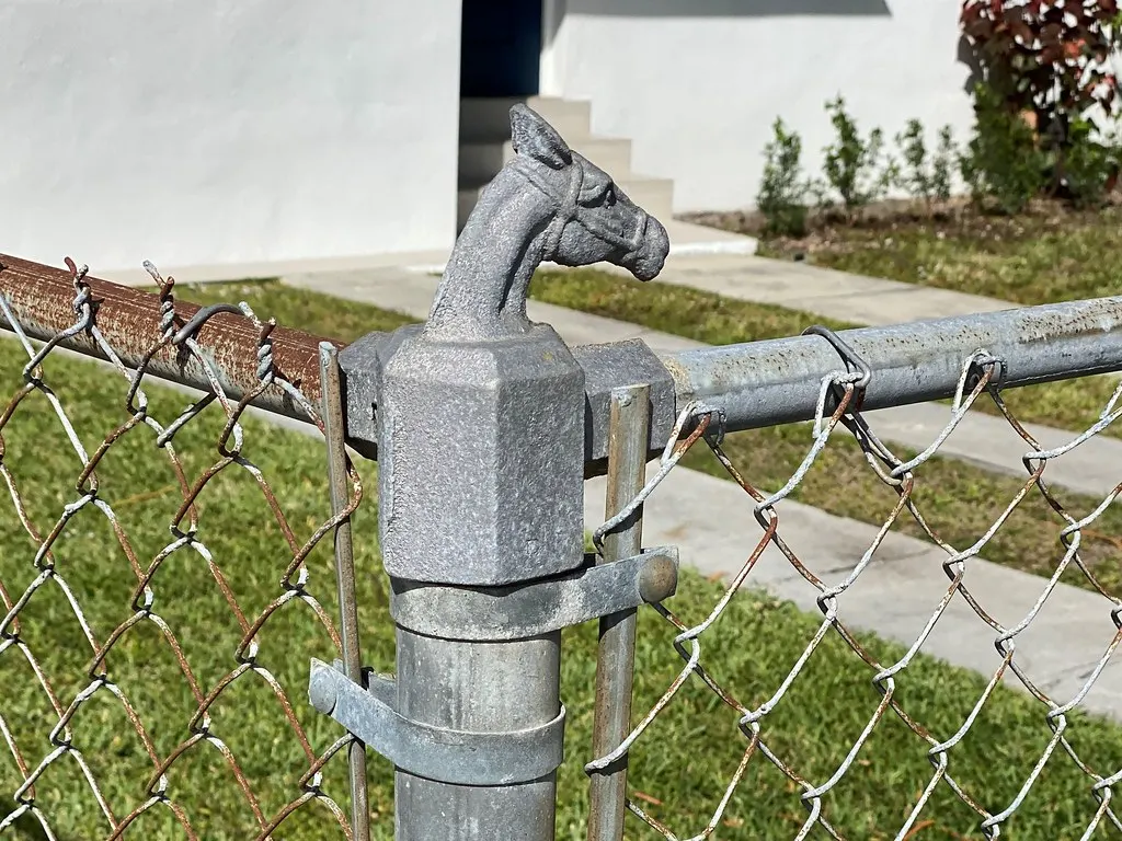 Chain link fence with a decorative post cap